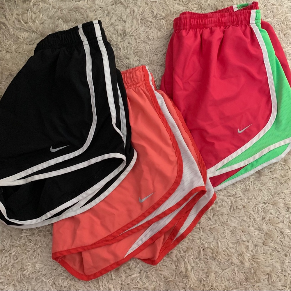 three pairs of nike shorts
